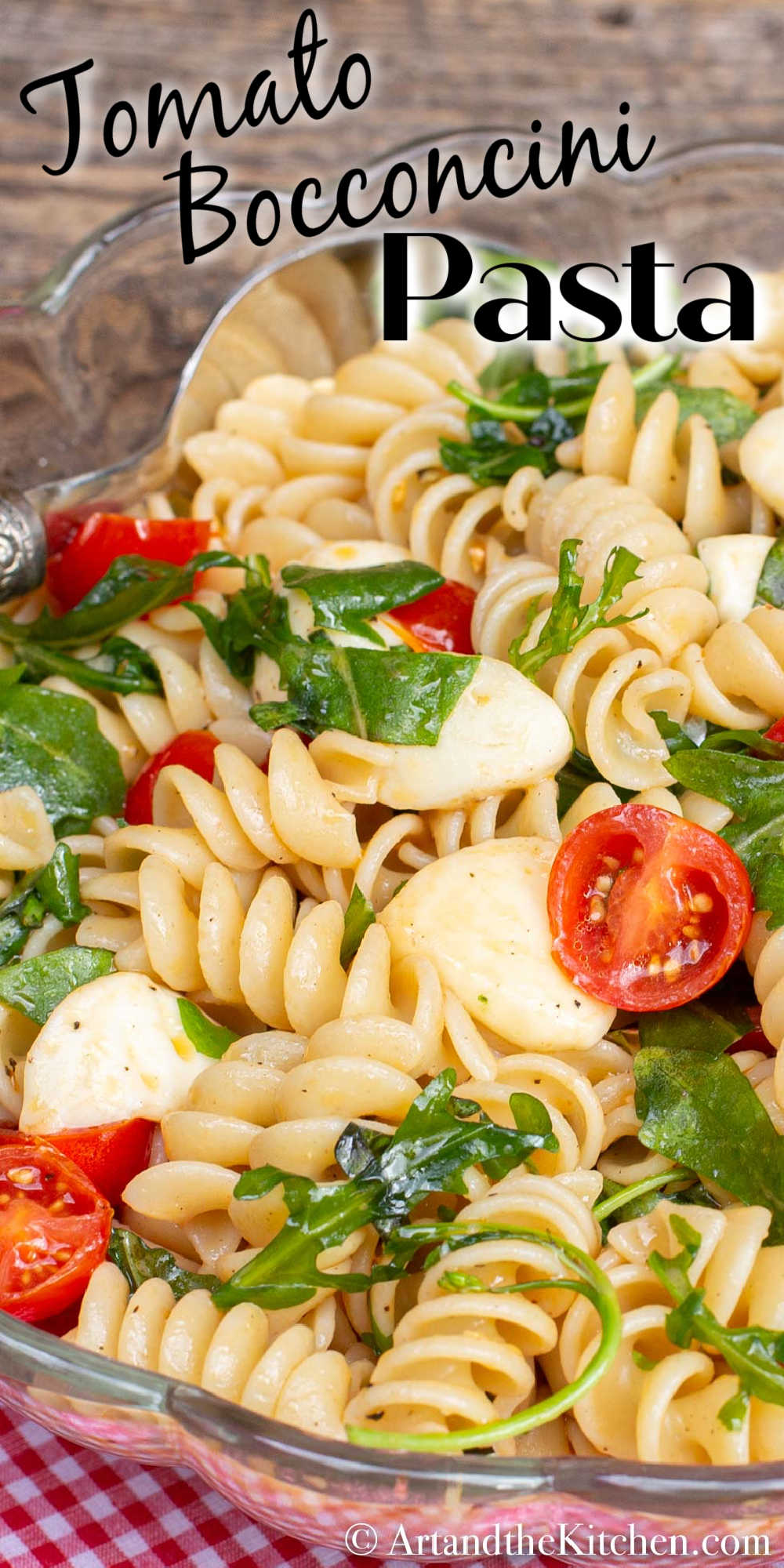 Tomato Bocconcini Pasta is a quick and simple recipe made with rotini pasta tossed together with bocconcini, garden fresh cherry tomatoes, arugula, and fresh basil. via @artandthekitch