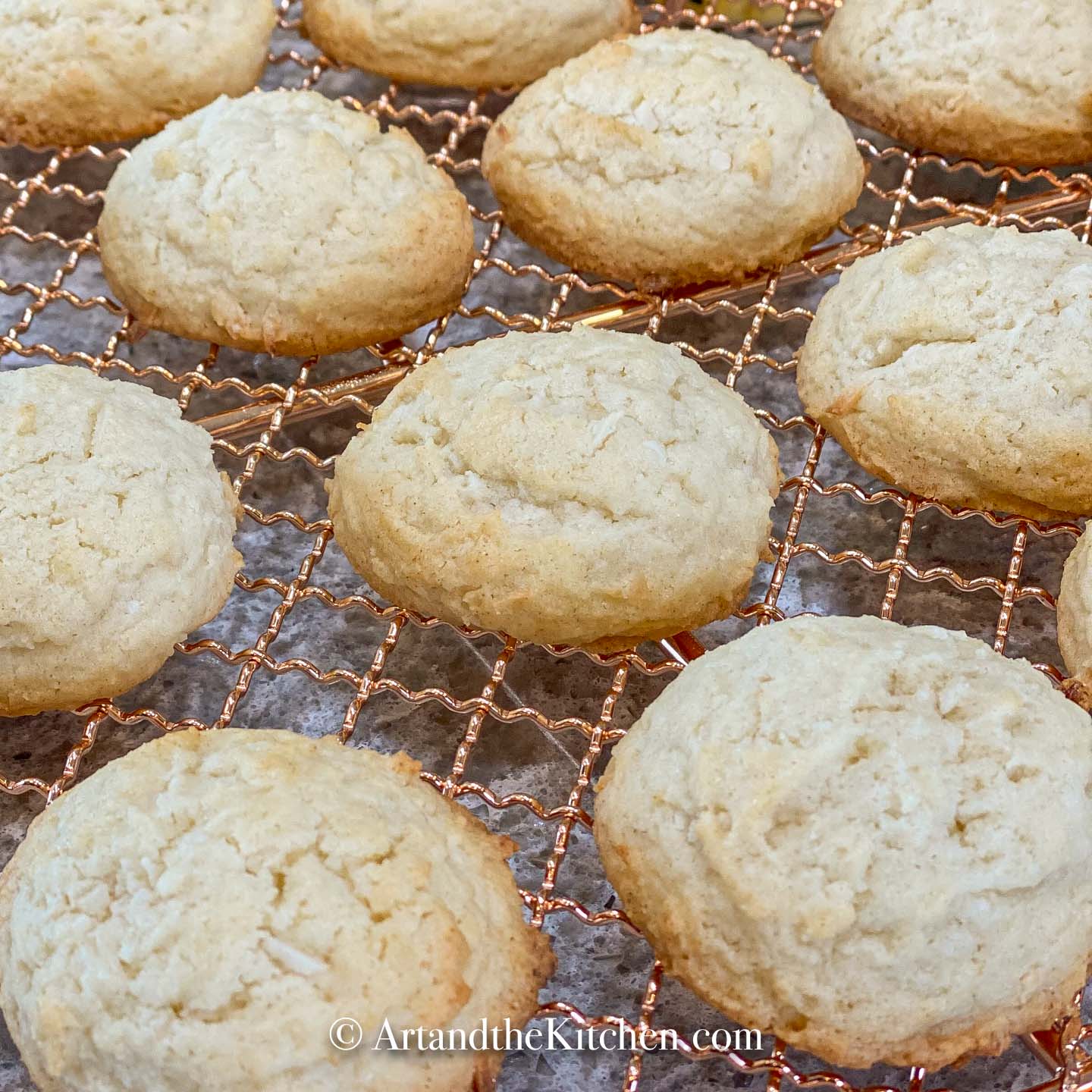 Copper baking rack filled with coconut sugar cookies.