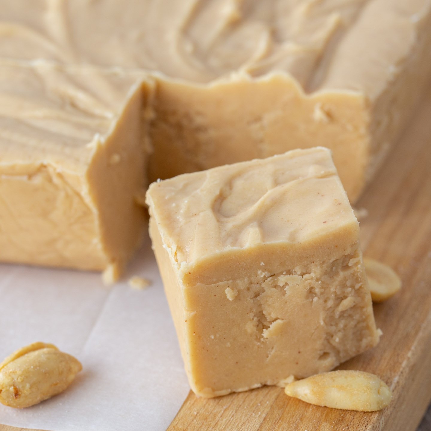 Cube of peanut butter fudge cut out of whole slab.