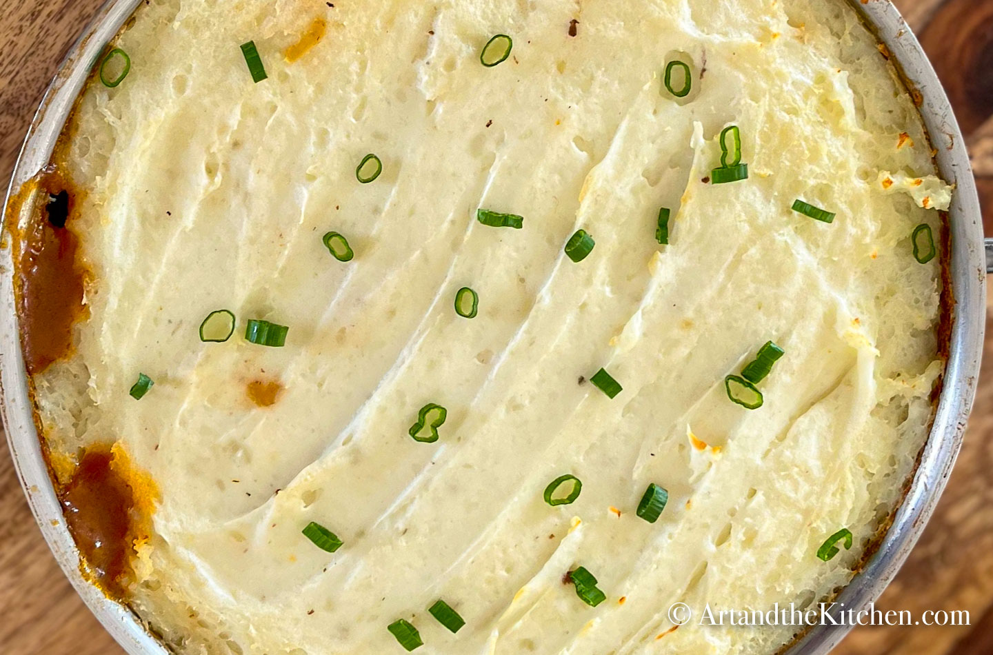 Baked shepherd's pie in stainless steel pan.