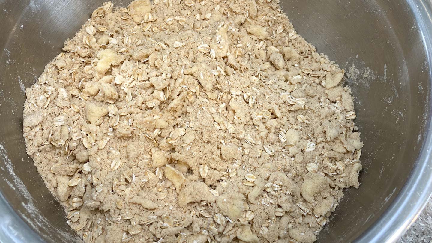 Butter crumb mixture in stainless steel bowl.