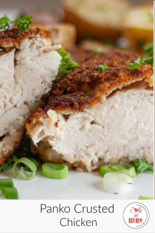 Cooked chicken breasts sliced in half coated with panko bread crumbs.