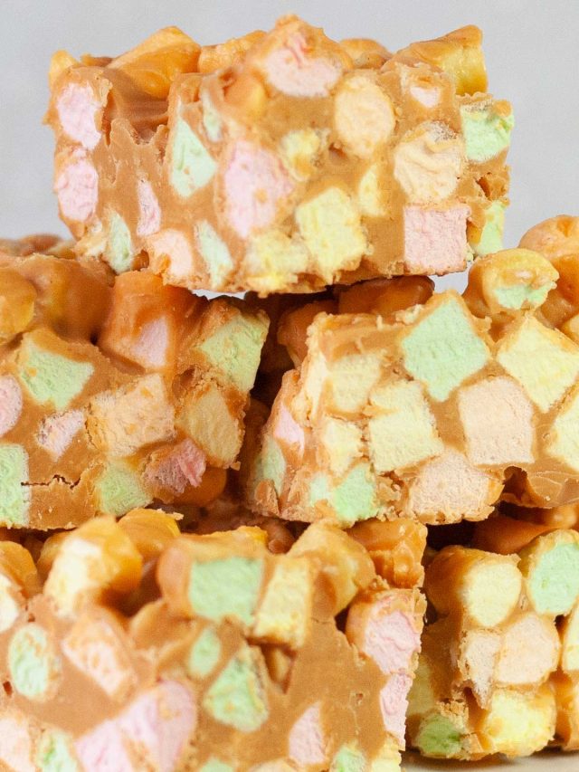 Stack of colorful, mini marshmallow squares mixed with peanut butter and butterscotch.