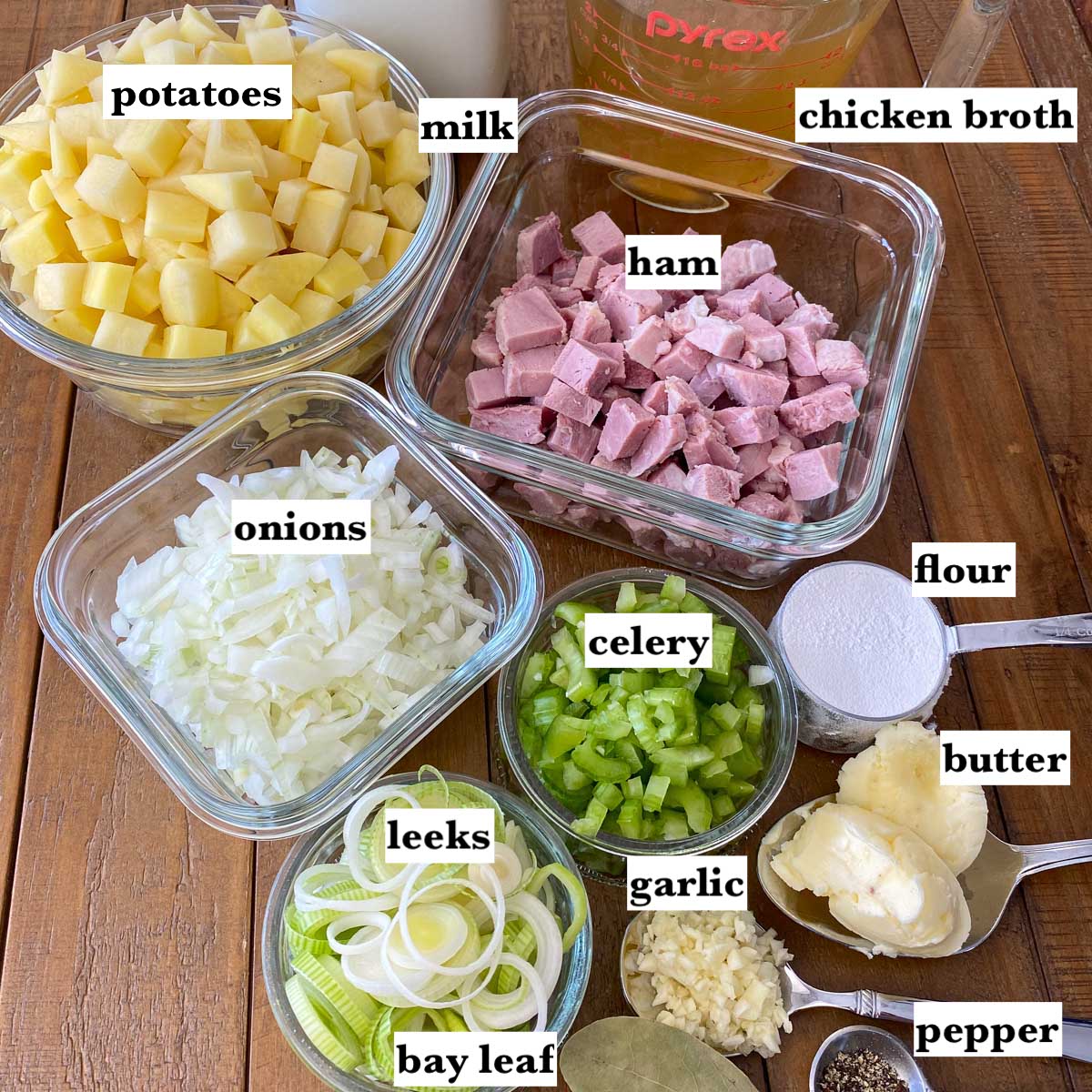 Ingredients measured in bowls for making potato soup.
