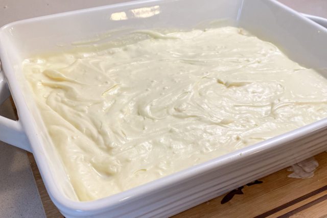 Cream cheese mixture spread on top of lemon cake crust.