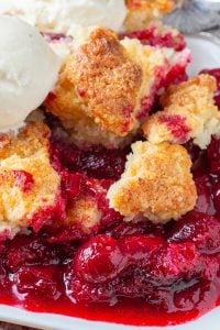 Cherry filling topped with cobbler biscuit crust and a scoop of vanilla ice cream.
