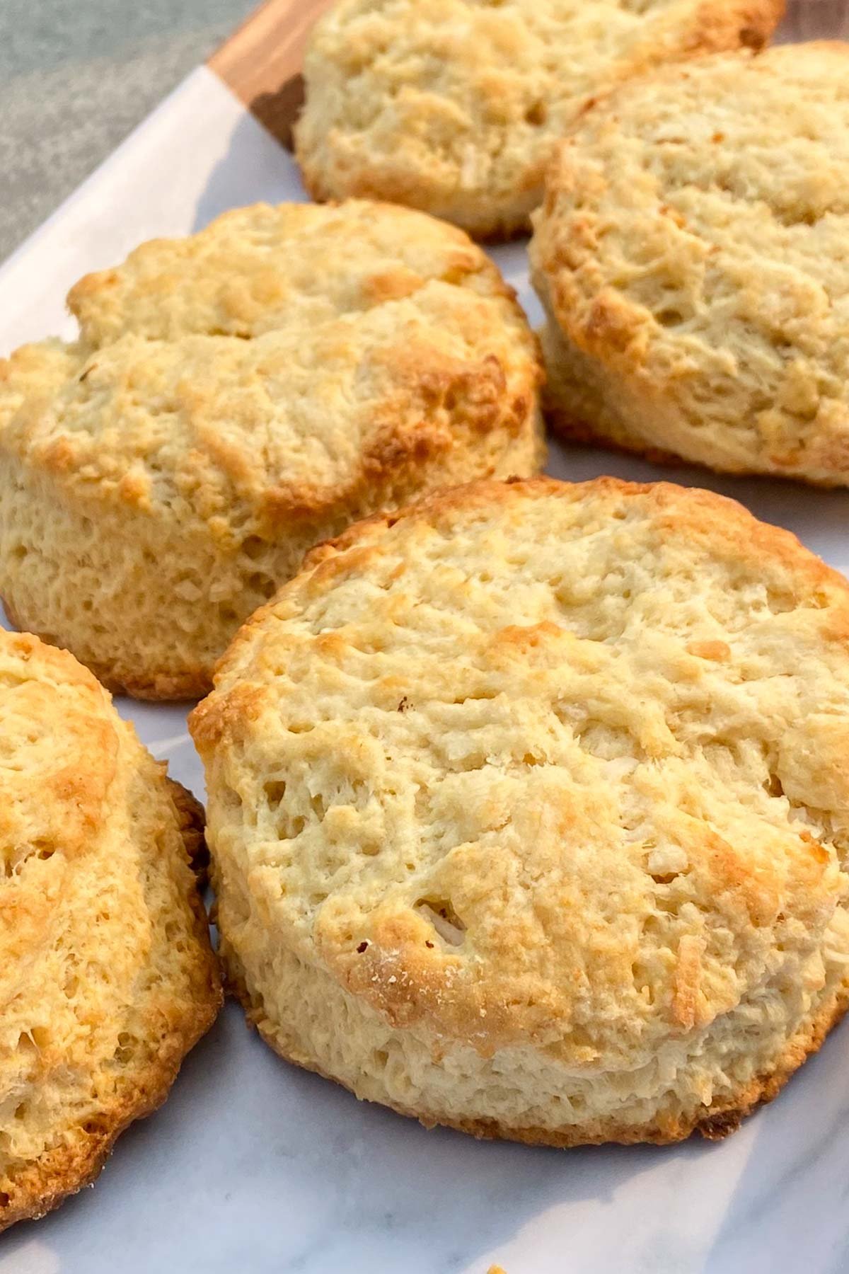 Freshly baked scones on parchment lined baking pan.