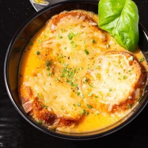 Tomato soup topped with toasted crostinis and parmesan cheese.