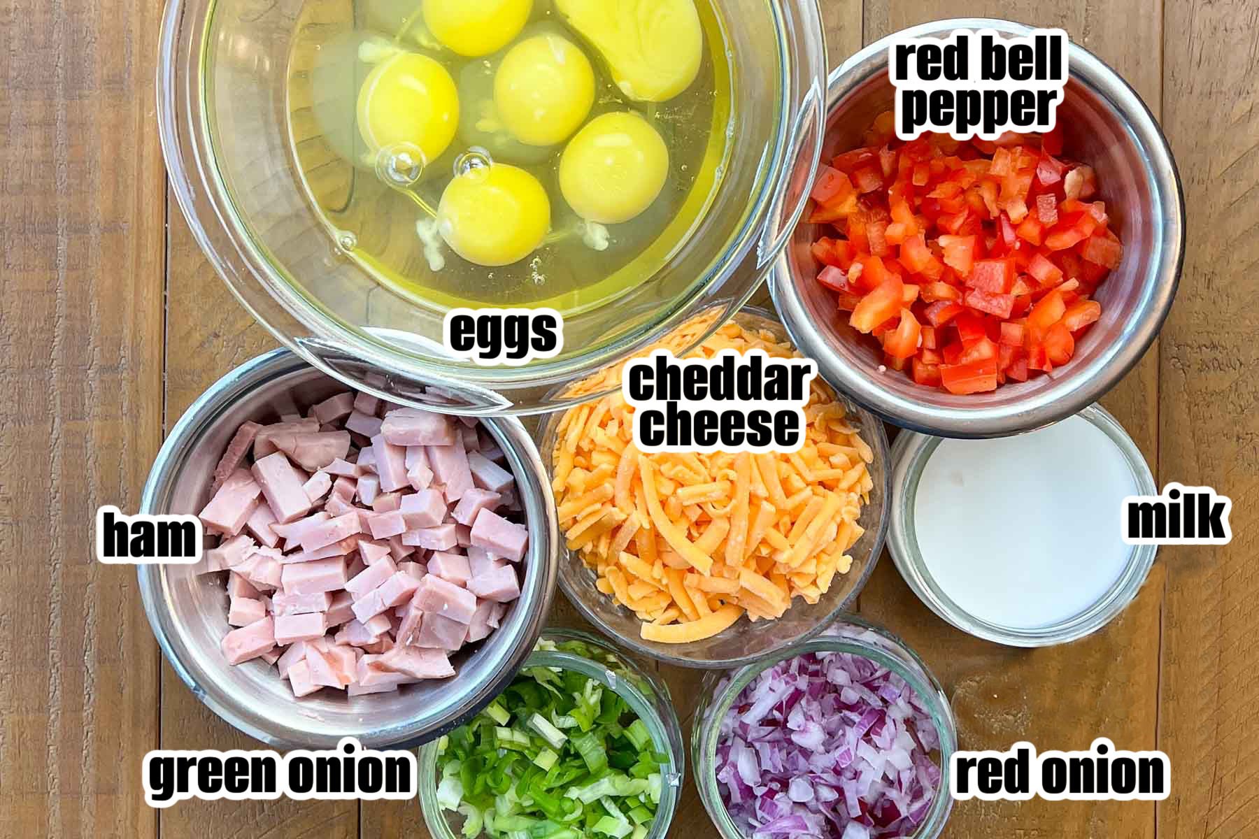 Ingredients in measuring bowls for making egg muffins.