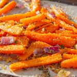 Pan roasted carrots with red onions, parsley and breadcrumbs.