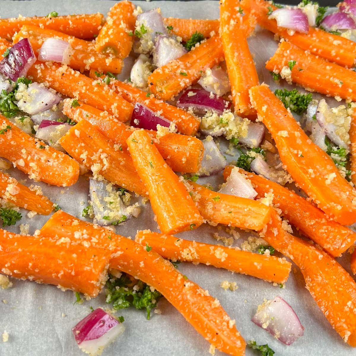 Pan roasted carrots with red onions, parsley and breadcrumbs.