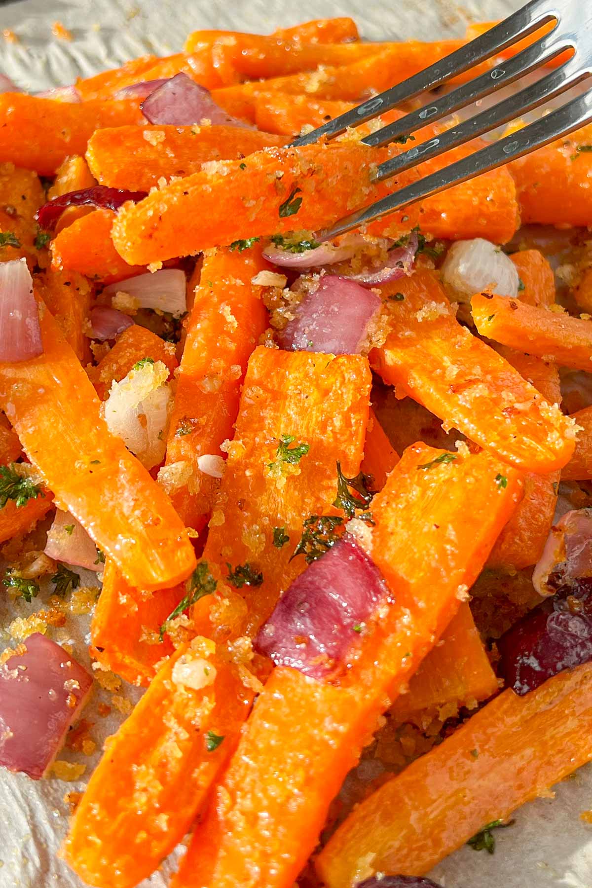 Pan roasted carrots with red onions, parsley and breadcrumbs.