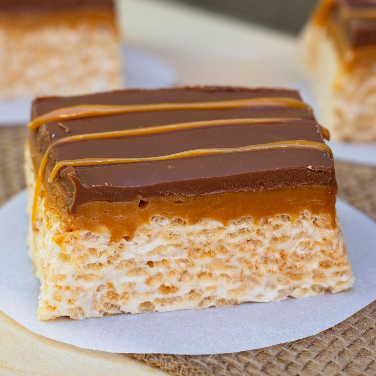 Rice Krispie treats with layers of caramel and chocolate.