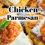 Cast iron skillet with chicken cutlets topped with marinara sauce melted cheese and fresh basil leaf.