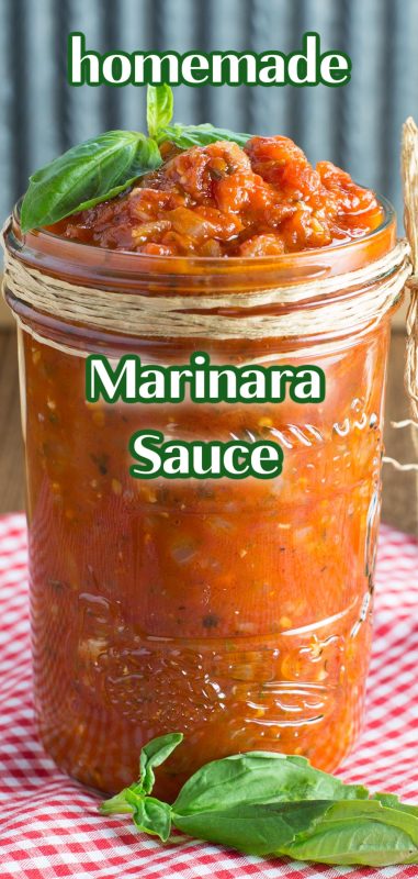 Homemade marinara sauce in glass jar decorated with basil leaves.