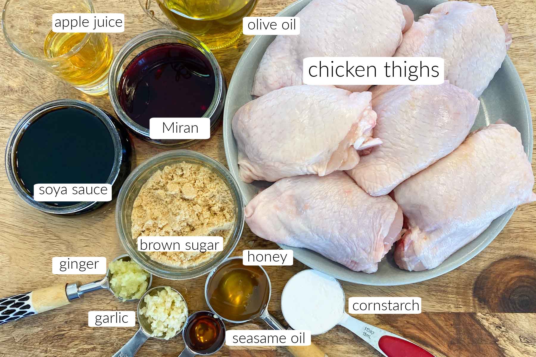 Ingredients measured out for making chicken thighs with teriyaki sauce.