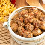 Serving bowl filled with turkey meatballs in a creamy sauce.