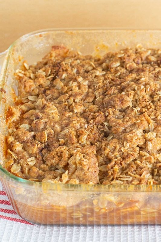 Apple crisp baked in a glass baking pan.