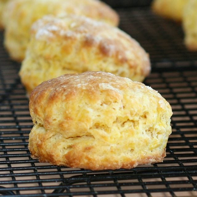 Squash scones on a black cooling rack.