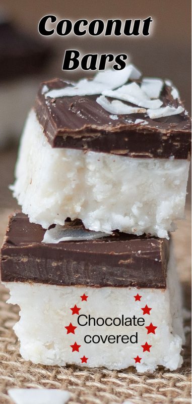 Stack of two coconut bars covered in a layer of chocolate.