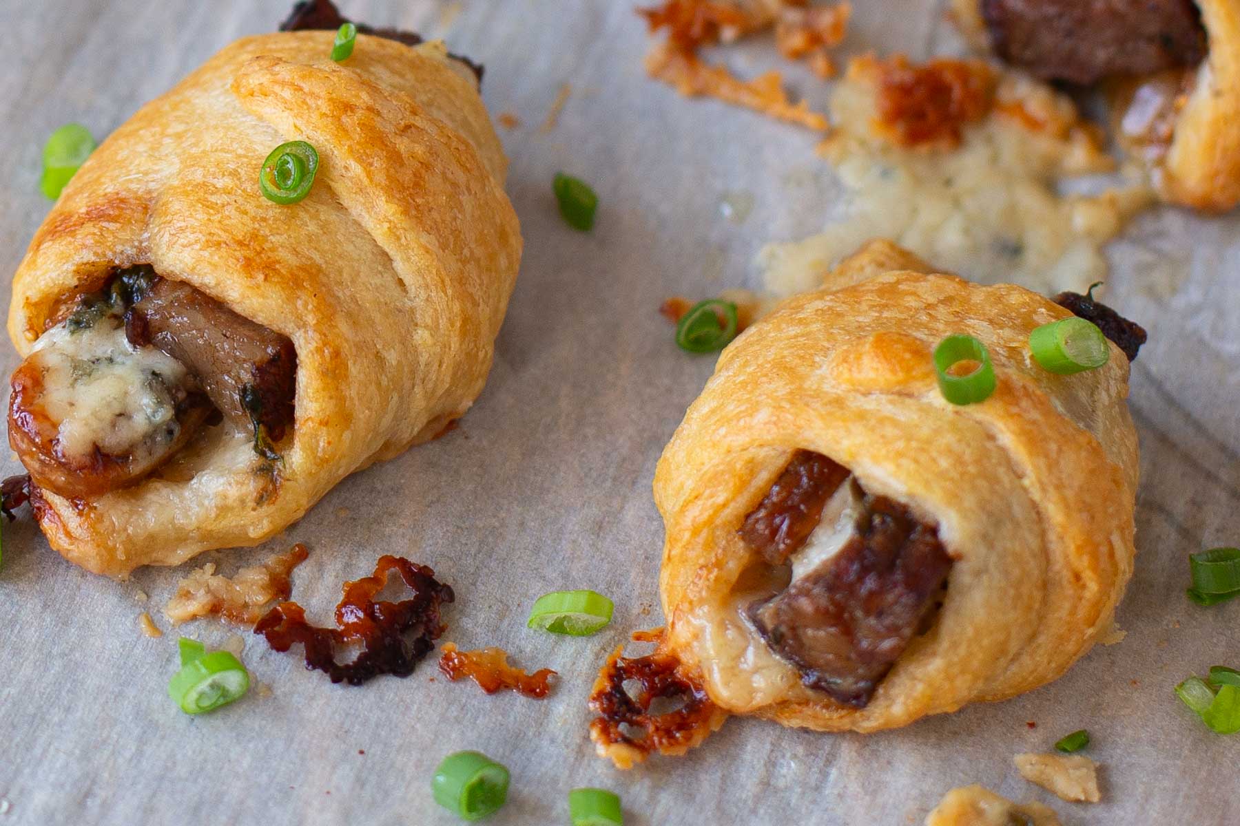 Baked steak and blue cheese bites wrapped in crescent rolls.