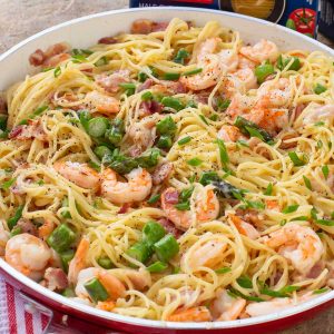 Skillet of spaghetti, shrimp and asparagus.