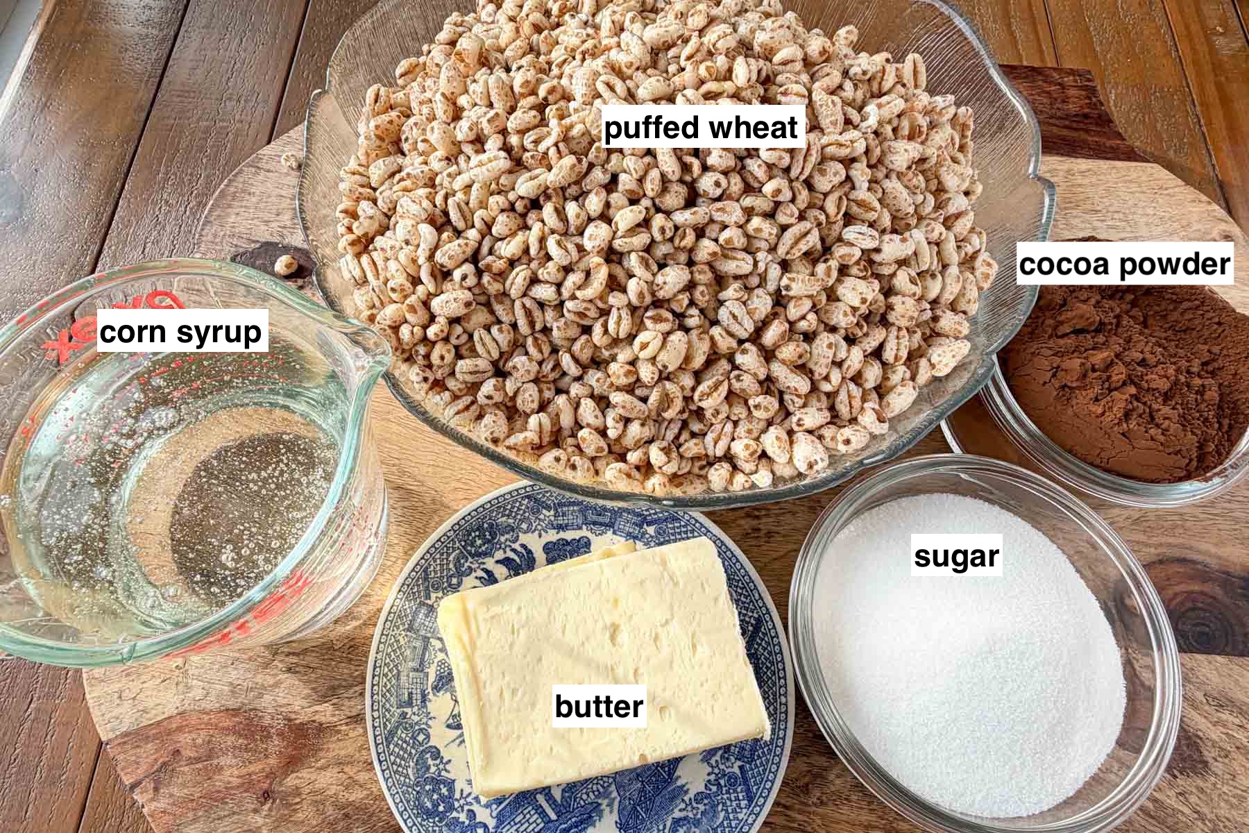 Ingredients measured in bowls for puffed wheat squares.