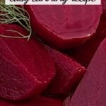 Cut up pickled beets in glass bowl, garnished with fresh dill sprigs.